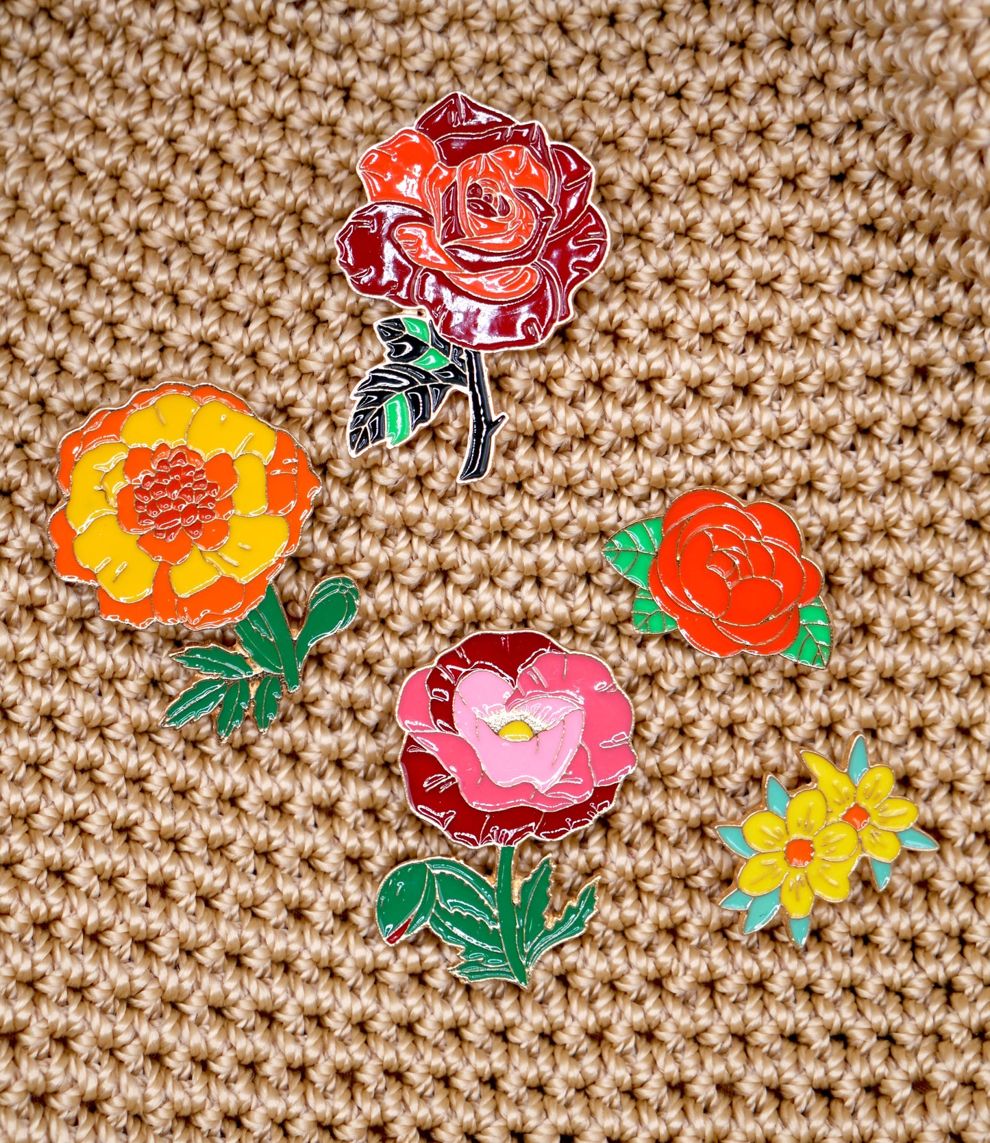 Get in the spring and summer feeling with a randomly chosen set of 3 flower enamel metal pins.
