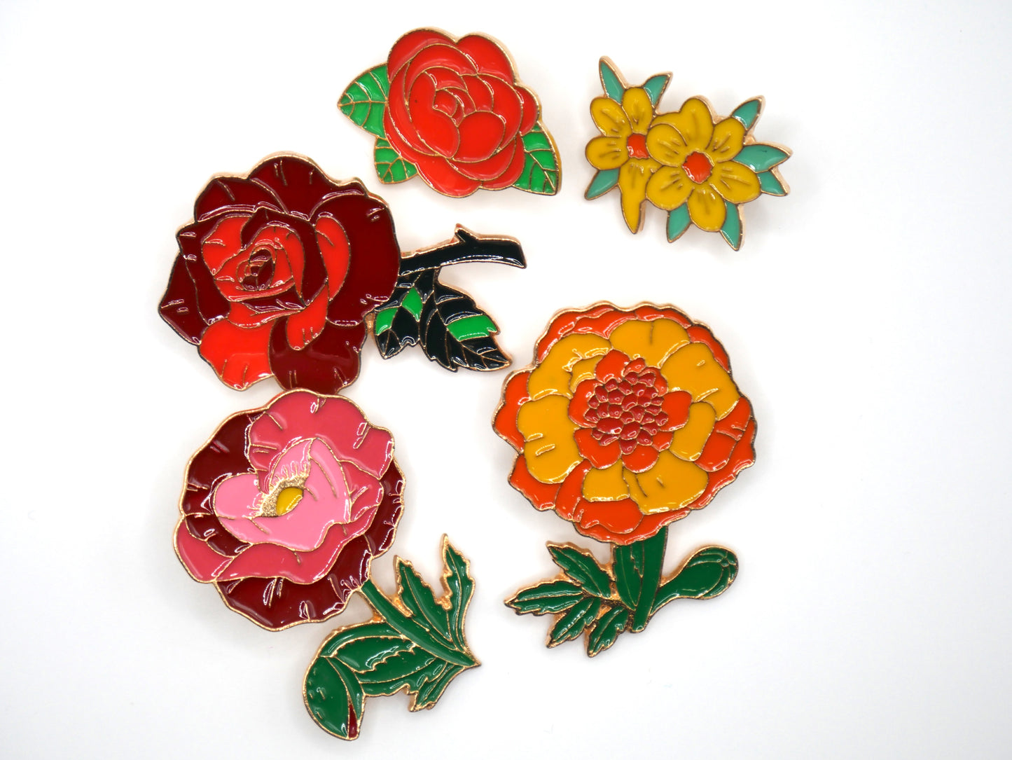 Get in the spring and summer feeling with a randomly chosen set of 3 flower enamel metal pins.