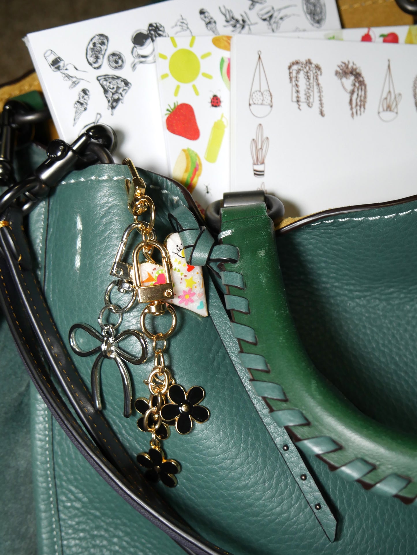 girl dinner, picnic, and houseplant notepads with bow, flower, and heart bag charms