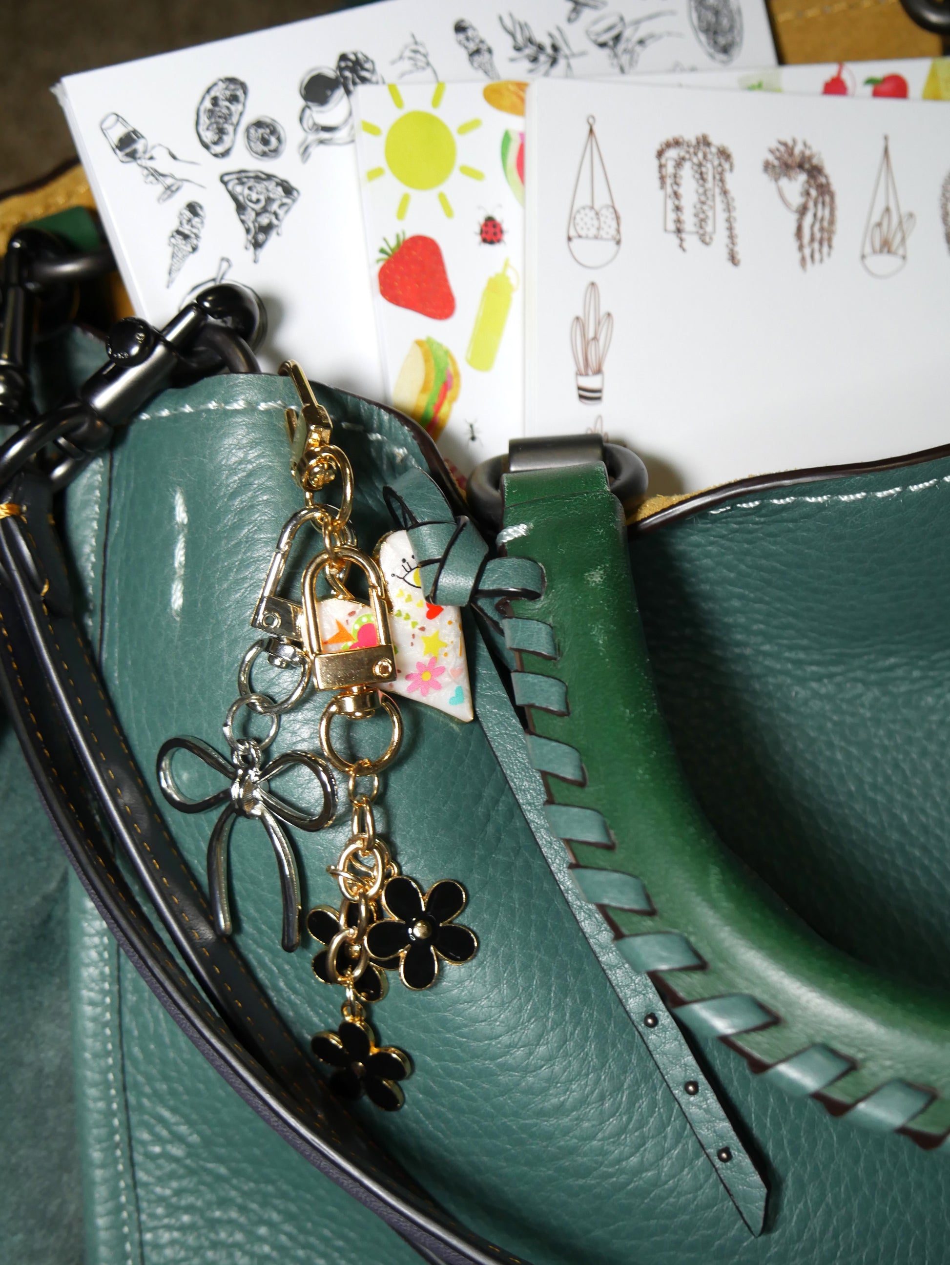 girl dinner, picnic, and houseplant notepads with bow, flower, and heart bag charms