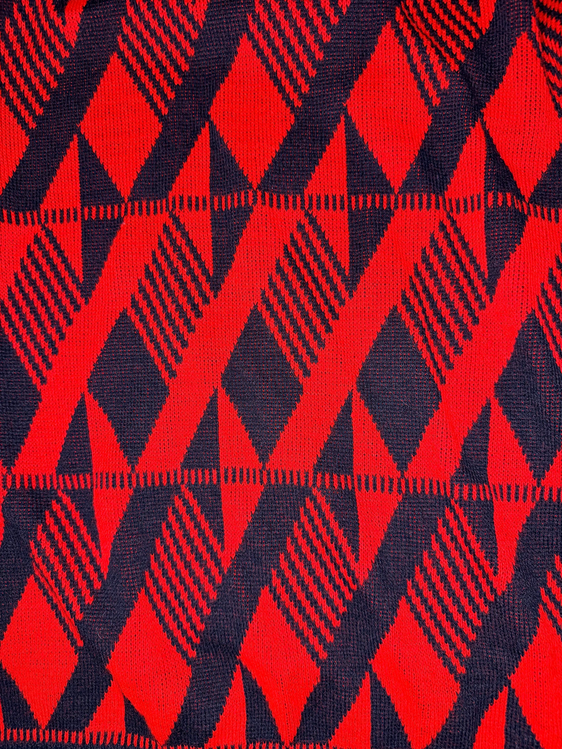 Close-up of red and black geometric patterned fabric