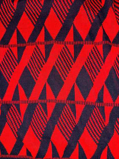 Close-up of red and black geometric patterned fabric