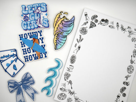 In this mystery bundle, you will receive:

1 notepad
1 iron-on patch OR 1 enamel pin set
1 bookmark set
1 sticker set
1 small bag charm/keychain