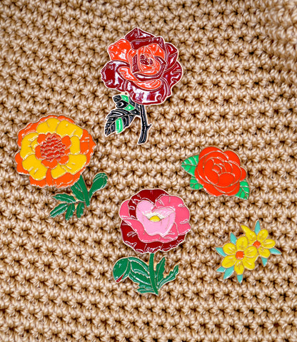 Get in the spring and summer feeling with a randomly chosen set of 3 flower enamel metal pins. 
