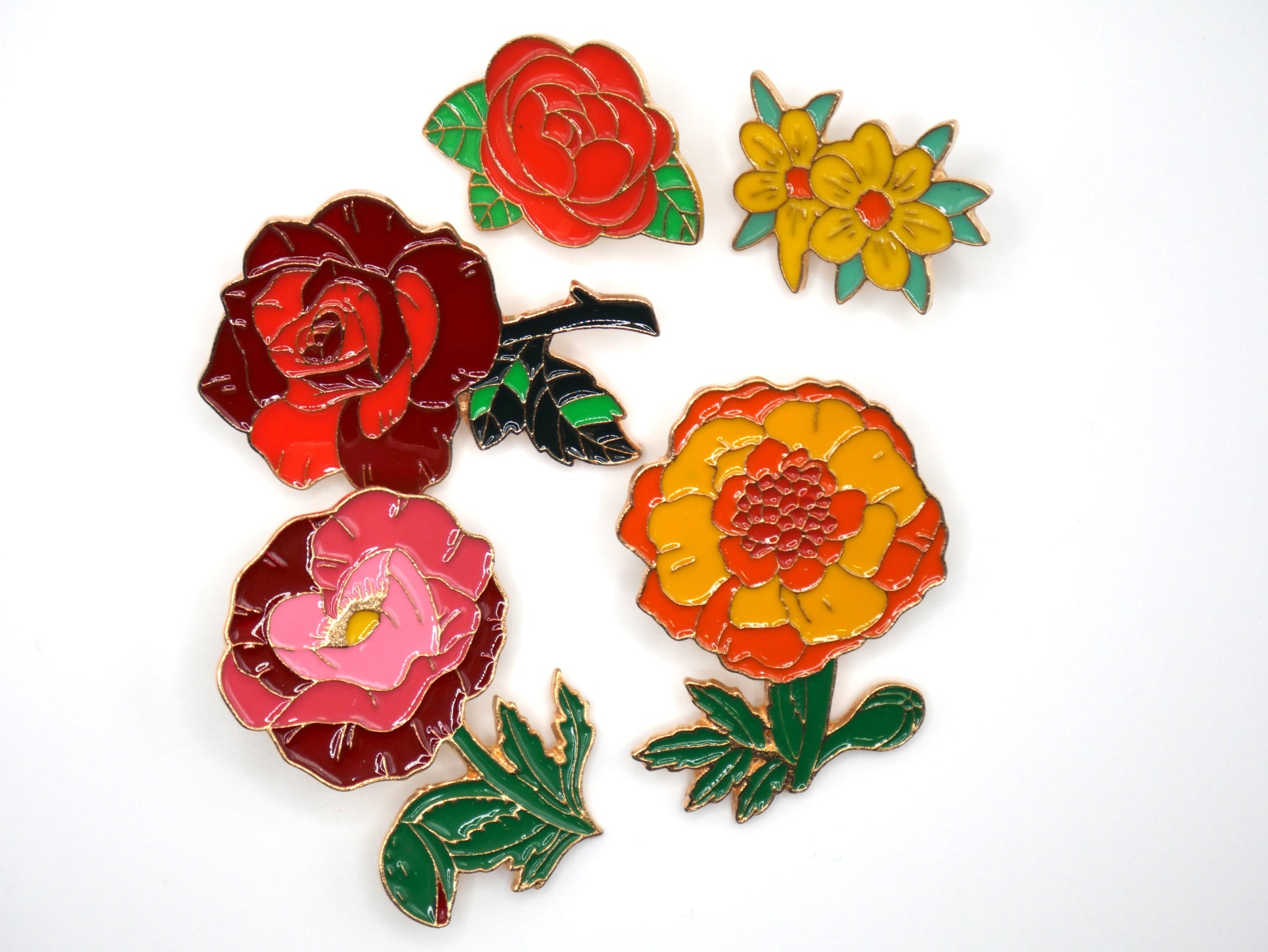 Get in the spring and summer feeling with a randomly chosen set of 3 flower enamel metal pins. 