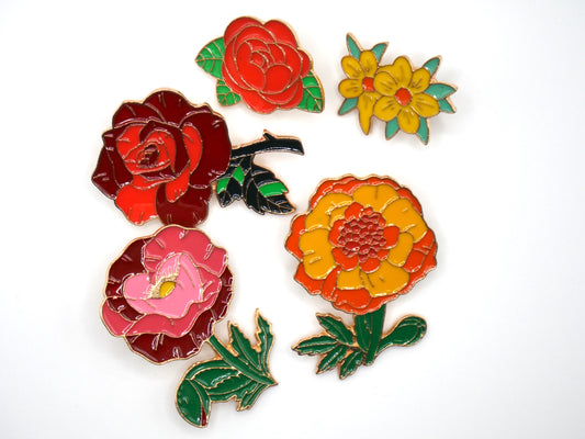 Get in the spring and summer feeling with a randomly chosen set of 3 flower enamel metal pins. 